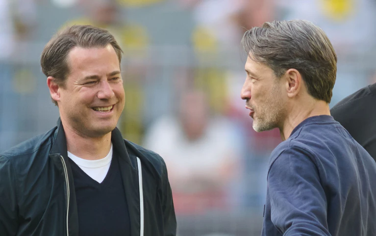 Wünschen Jamal Musiala alles Gute: Lars Ricken (l) und Niko Kovac. (Archivbild) — © Bernd Thissen/dpa